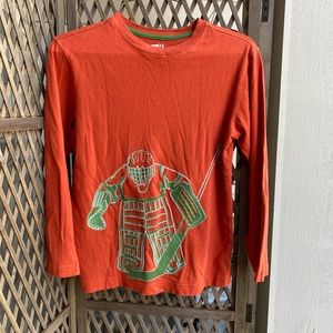 Embroidered goaltender T 4 your little hockey fan.